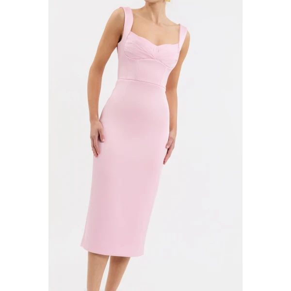 enhanced with a back split for a touch of allure. Lined and secured with a zip fastening at the back