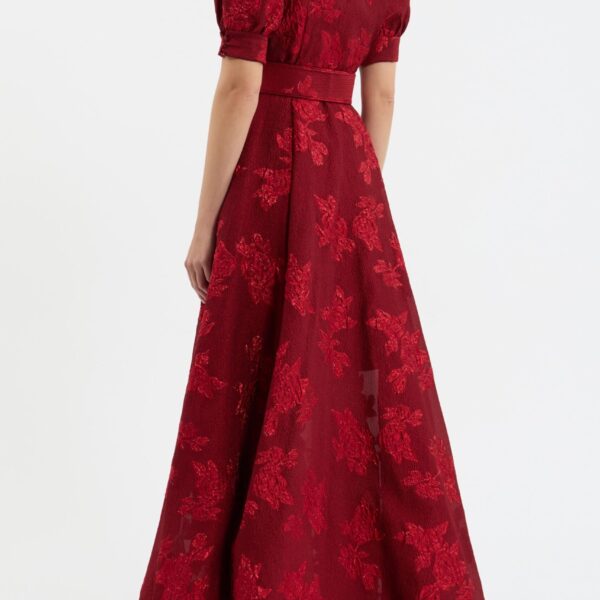 while the voluminous circular skirt creates a flattering silhouette. Side seam pockets add a practical touch