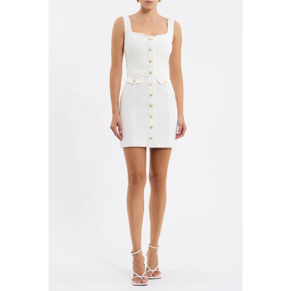 it accentuates the feminine silhouette with a sculpted sweetheart neckline and cinched waist. Intricate contrast stitching