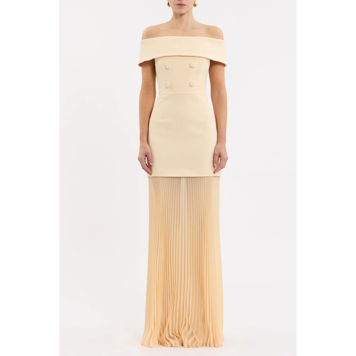 cinched at the waist to accentuate the flattering fit. The sheer pleated maxi skirt creates graceful silhouette