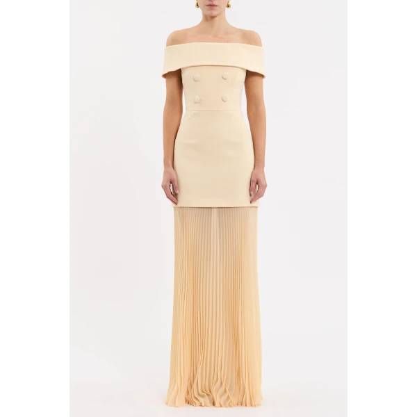 cinched at the waist to accentuate the flattering fit. The sheer pleated maxi skirt creates graceful silhouette