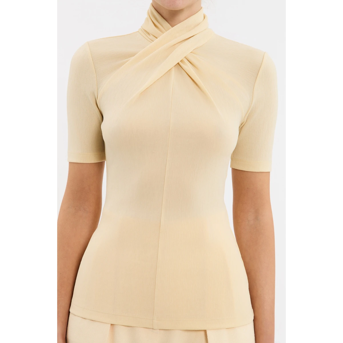 Rebecca Vallance Yellow Tops The Arial Short Sleeve Top in a playful butter-yellow hue infuses sophistication and comfort. Tailored from a premium textured jersey