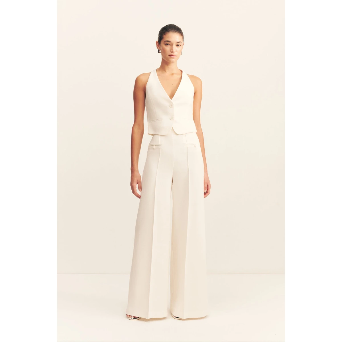 Fitted vest in a textured crepe fabrication.