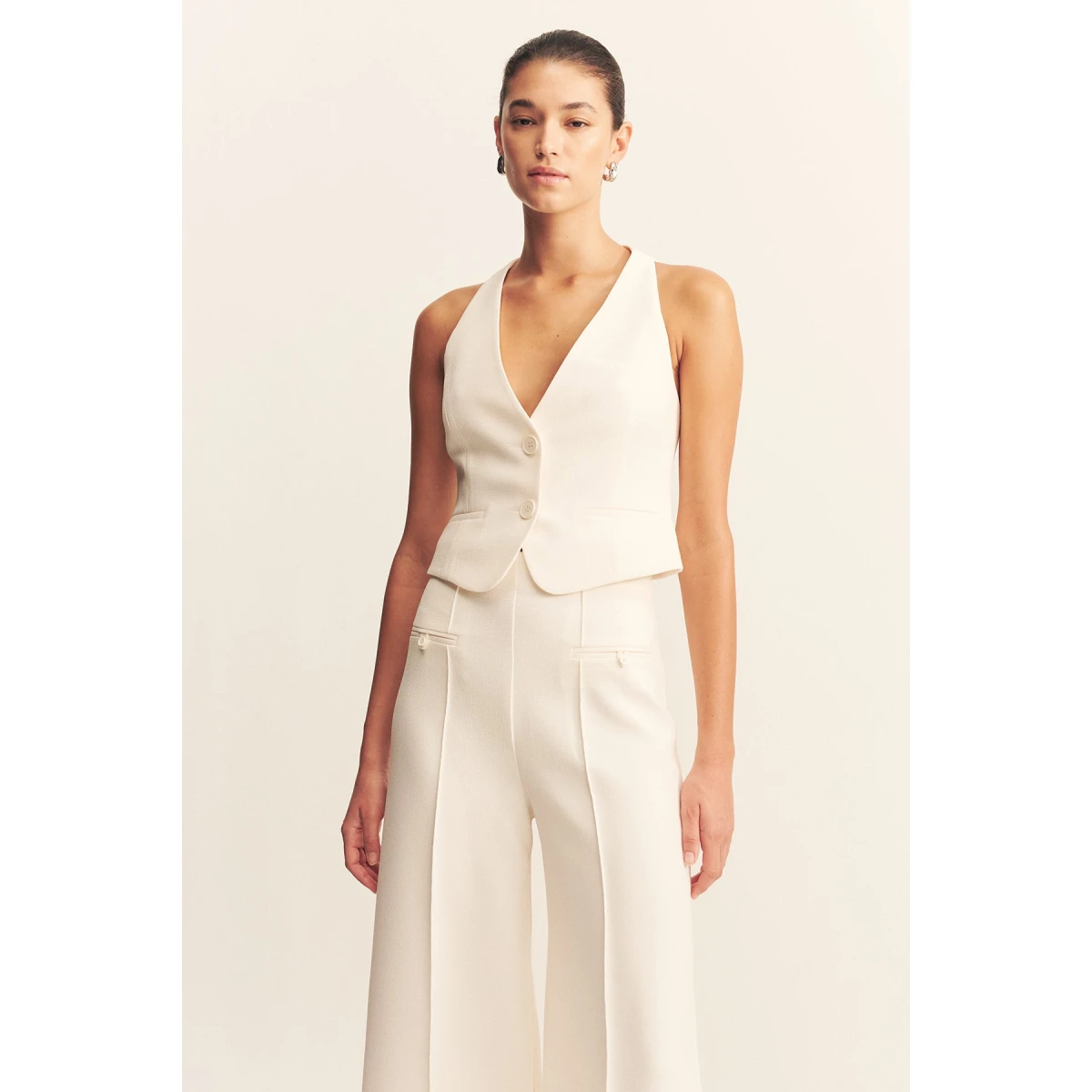 Fitted vest in a textured crepe fabrication.