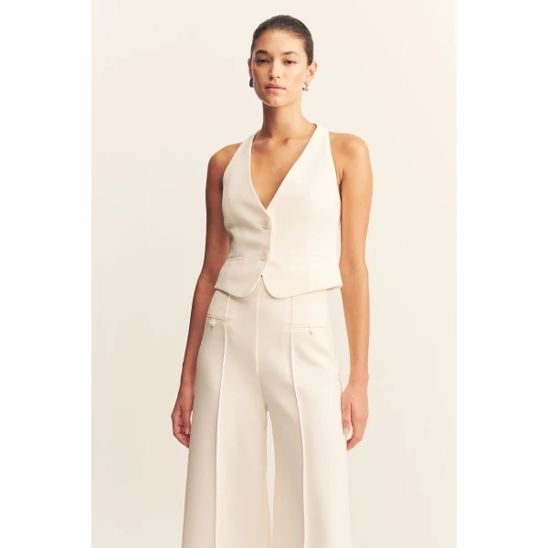 Fitted vest in a textured crepe fabrication.