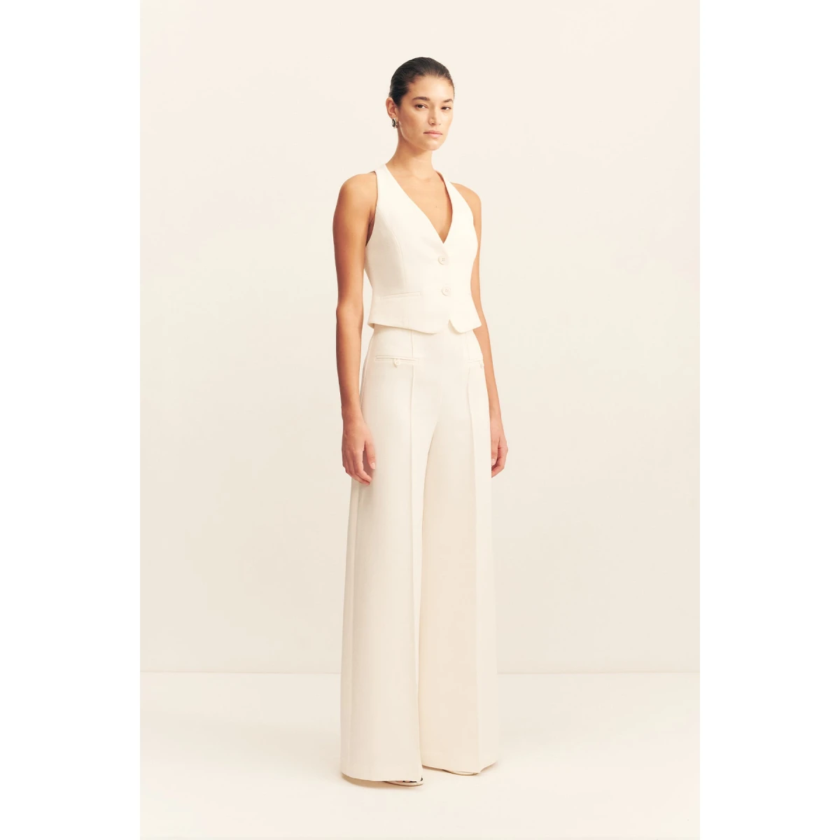 Fitted vest in a textured crepe fabrication.