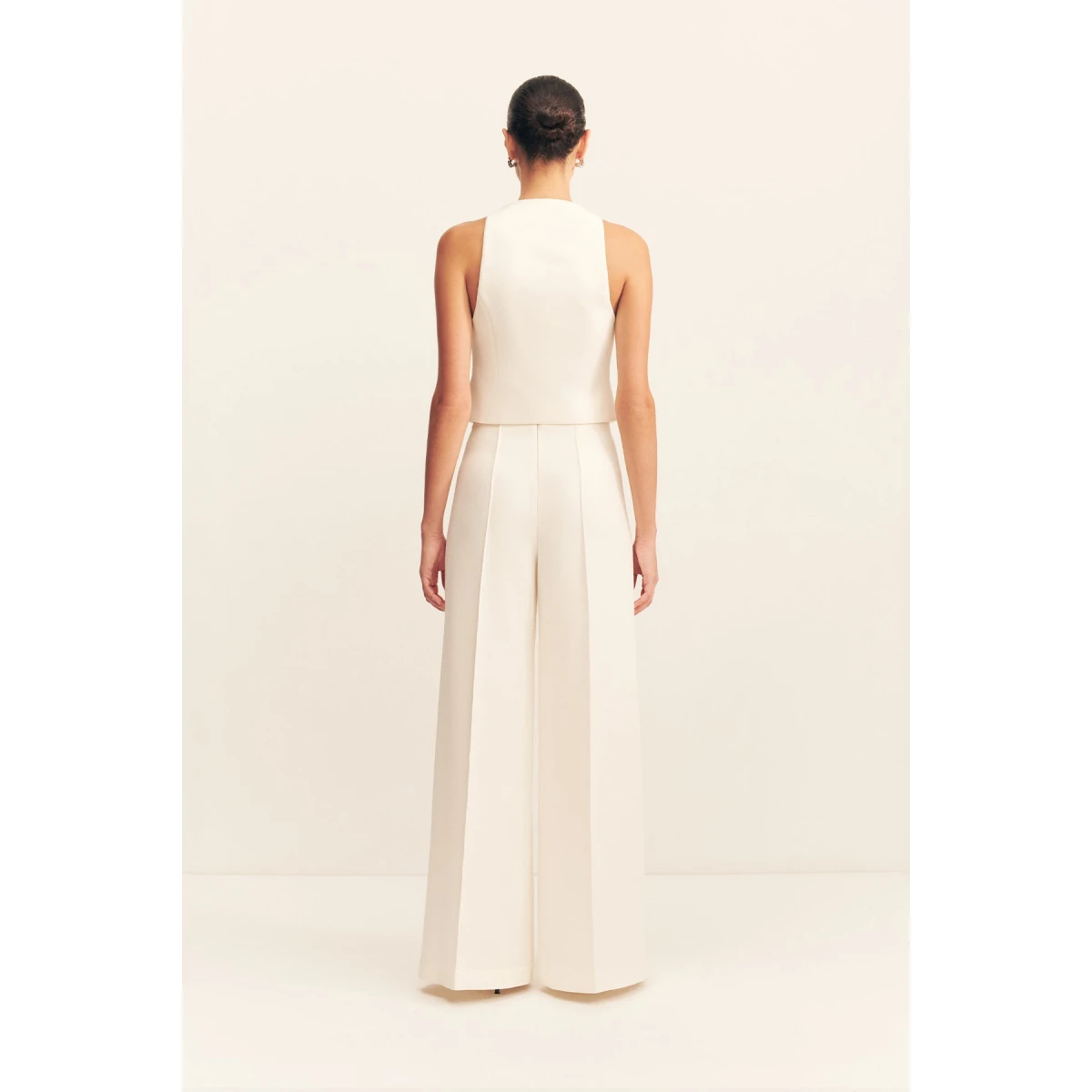 Fitted vest in a textured crepe fabrication.