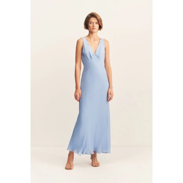 Plunged maxi dress in vista blue in a semi-sheer georgette.