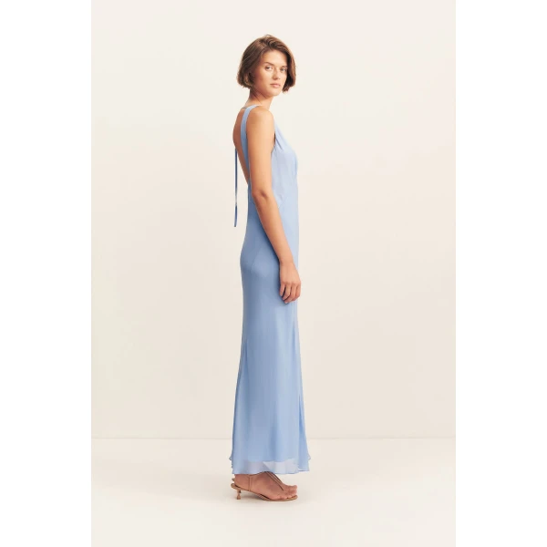 Plunged maxi dress in vista blue in a semi-sheer georgette.