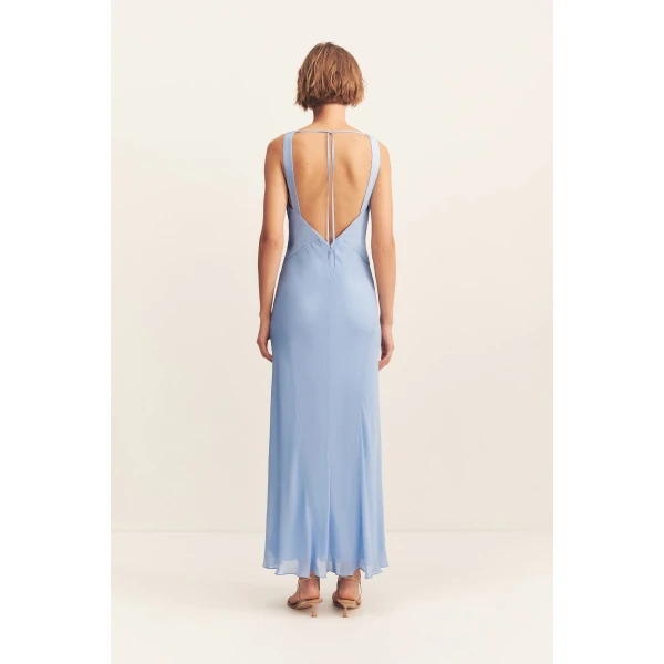 Plunged maxi dress in vista blue in a semi-sheer georgette.
