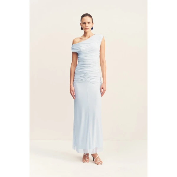 Asymmetrical off shoulder maxi dress in sky in a sheer mesh.