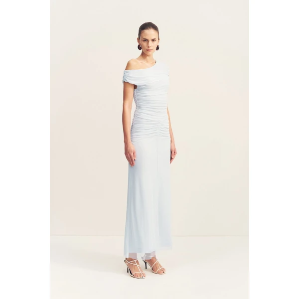 Asymmetrical off shoulder maxi dress in sky in a sheer mesh.