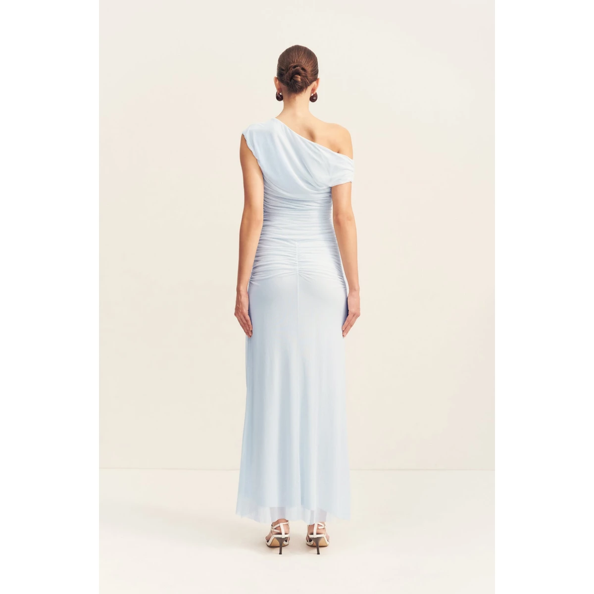 Asymmetrical off shoulder maxi dress in sky in a sheer mesh.