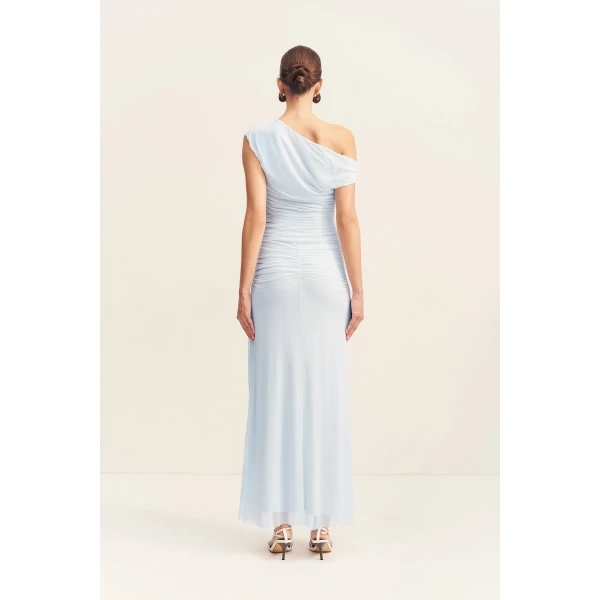 Asymmetrical off shoulder maxi dress in sky in a sheer mesh.