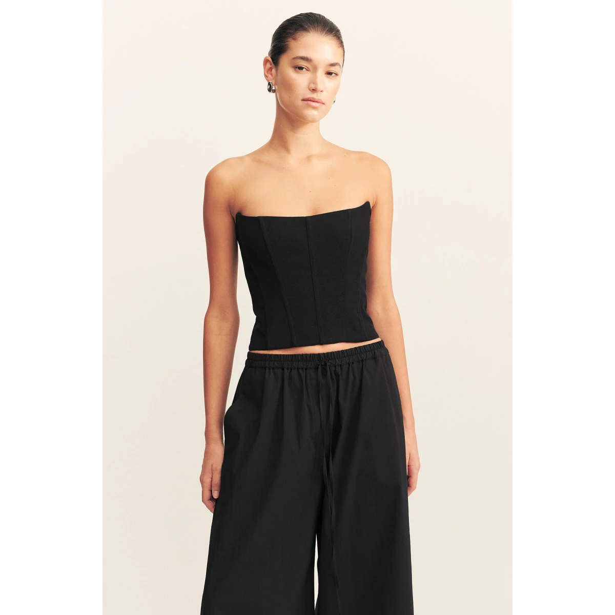 Strapless panelled corset in black in a textured ottoman viscose.