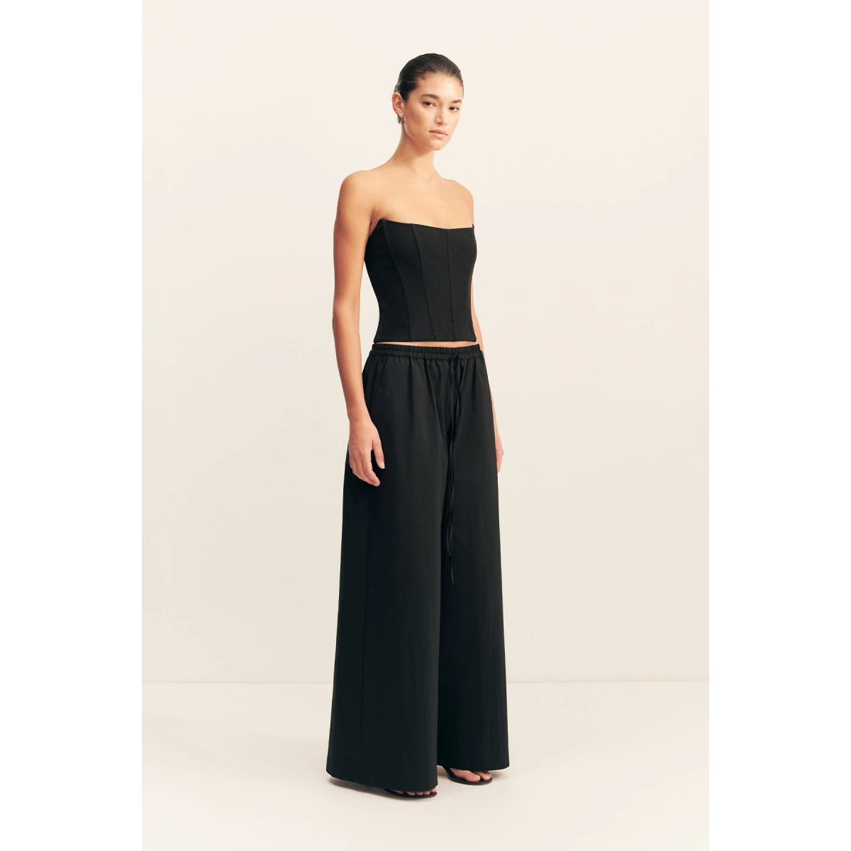 Strapless panelled corset in black in a textured ottoman viscose.
