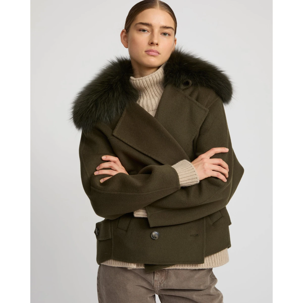 Woman wearing Yves Salomon shearling fur coat – luxury outerwear at Coveti
