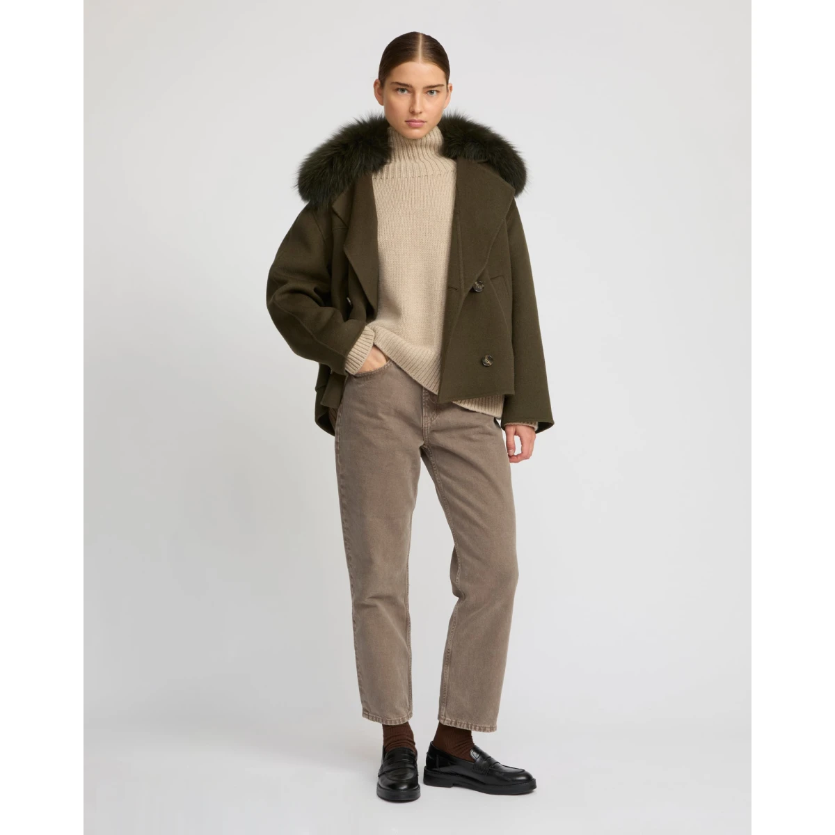 Woman wearing Yves Salomon shearling fur coat – luxury outerwear at Coveti