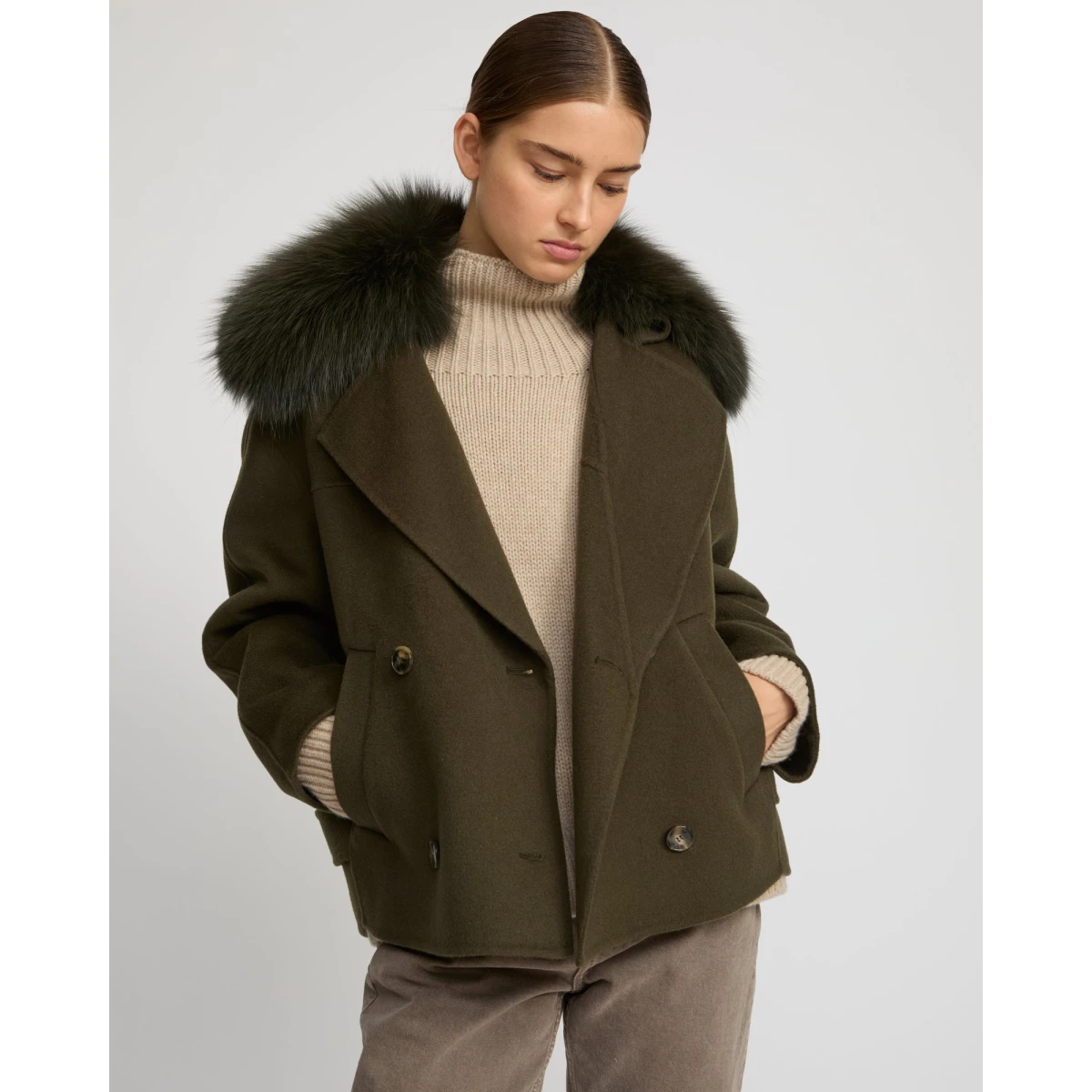 Woman wearing Yves Salomon shearling fur coat – luxury outerwear at Coveti