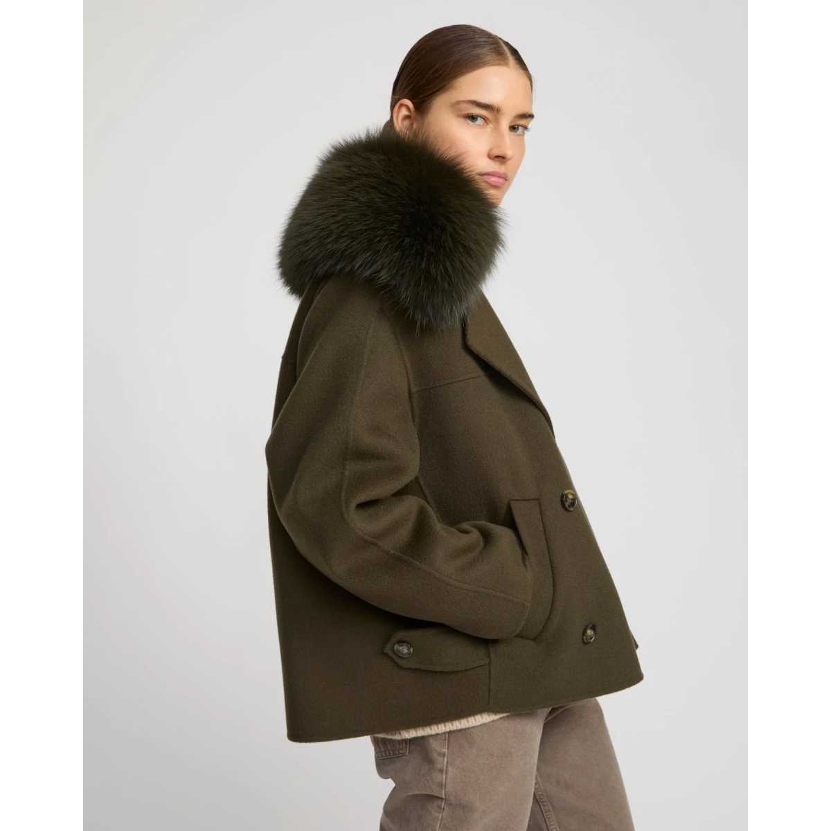 Woman wearing Yves Salomon shearling fur coat – luxury outerwear at Coveti