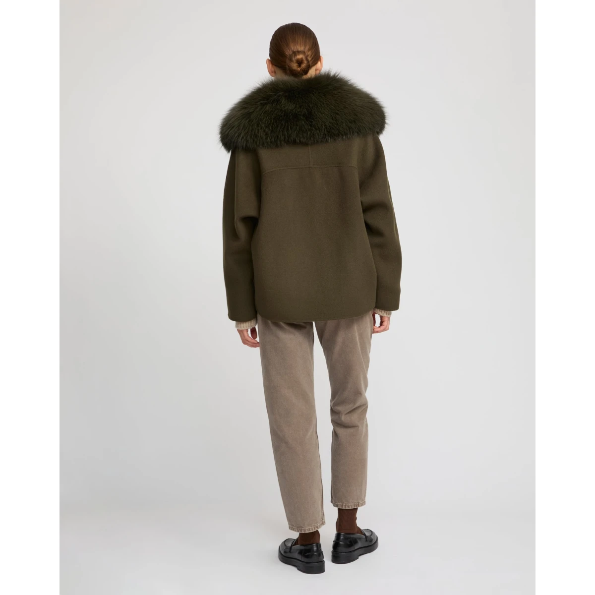 Woman wearing Yves Salomon shearling fur coat – luxury outerwear at Coveti