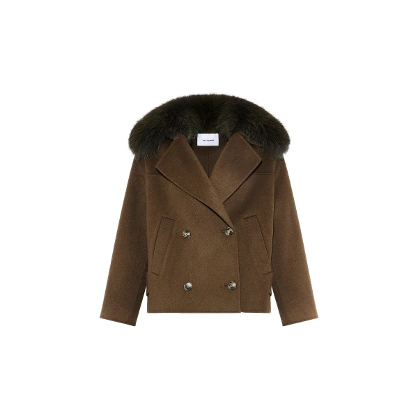 Woman wearing Yves Salomon shearling fur coat – luxury outerwear at Coveti