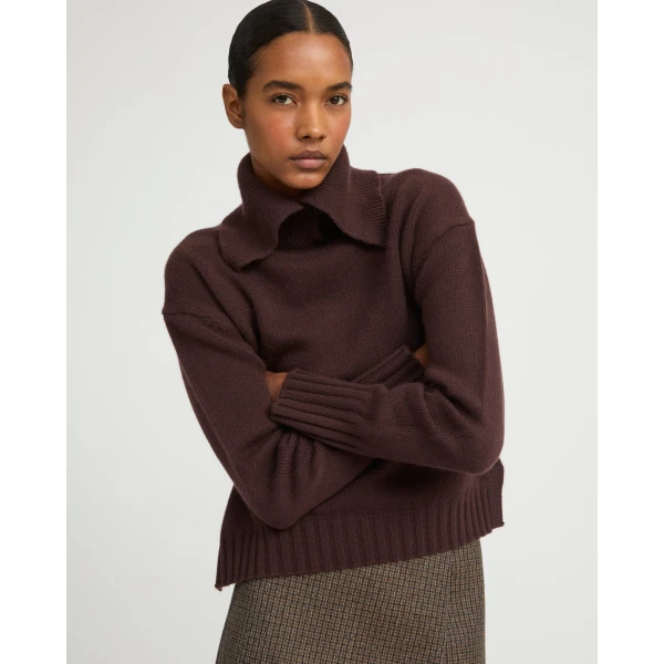 Woman wearing Yves Salomon shearling fur coat – luxury outerwear at Coveti