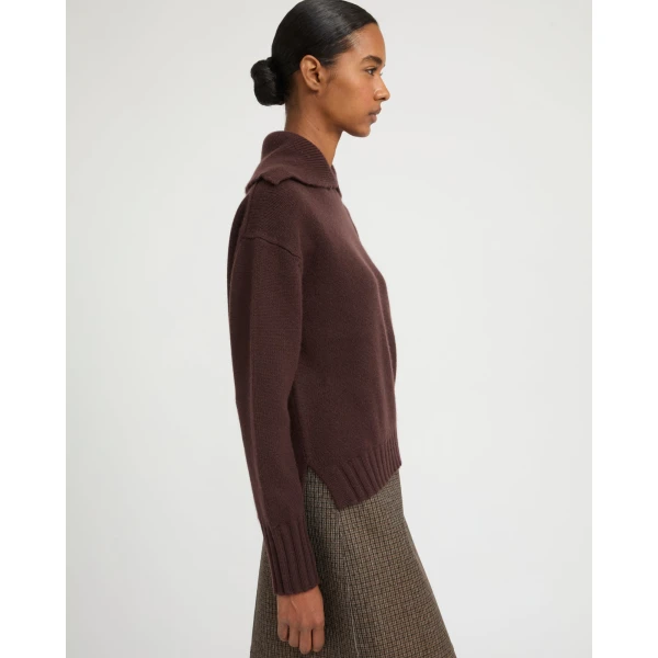 Woman wearing Yves Salomon shearling fur coat – luxury outerwear at Coveti