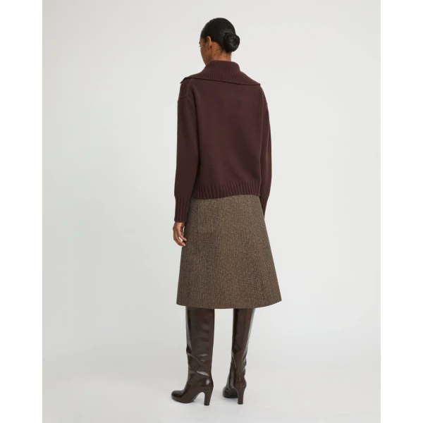 Woman wearing Yves Salomon shearling fur coat – luxury outerwear at Coveti