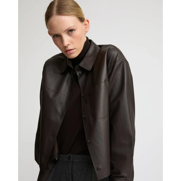 Woman wearing Yves Salomon shearling fur coat – luxury outerwear at Coveti