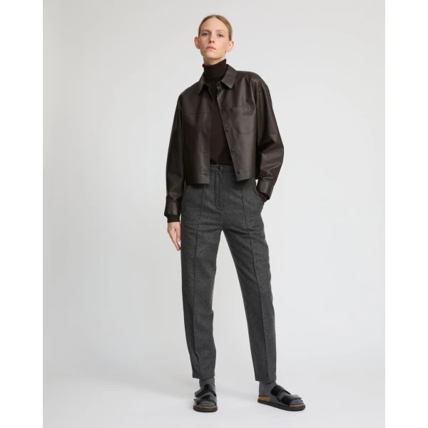 Woman wearing Yves Salomon shearling fur coat – luxury outerwear at Coveti
