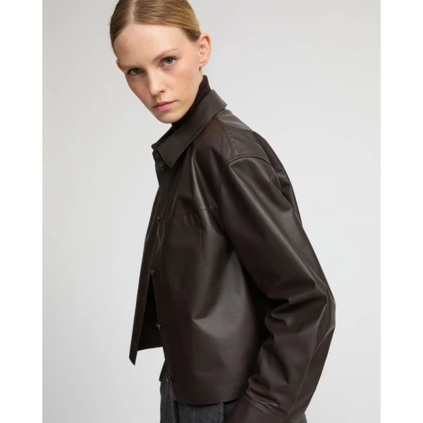 Woman wearing Yves Salomon shearling fur coat – luxury outerwear at Coveti