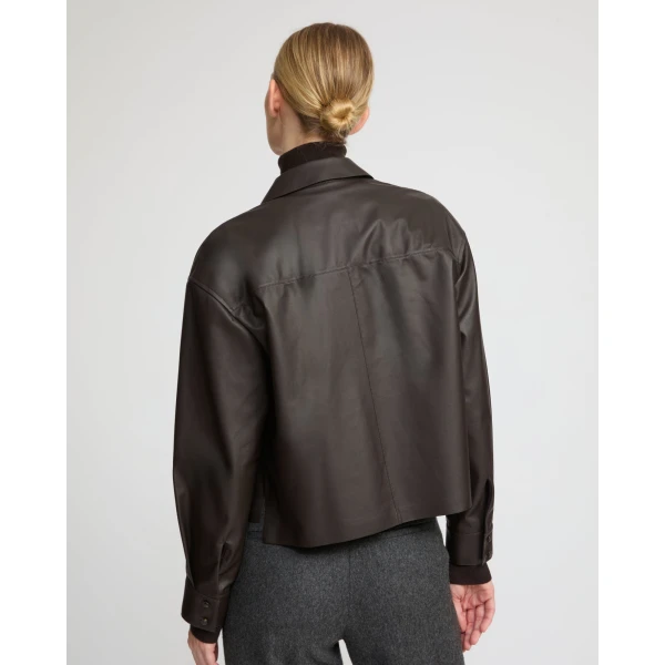 Woman wearing Yves Salomon shearling fur coat – luxury outerwear at Coveti