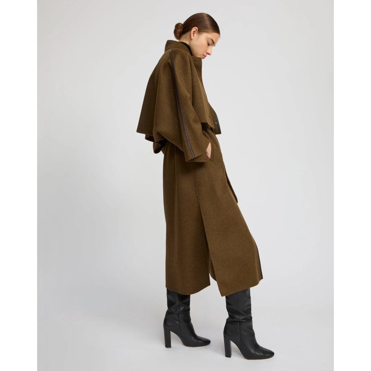Woman wearing Yves Salomon shearling fur coat – luxury outerwear at Coveti