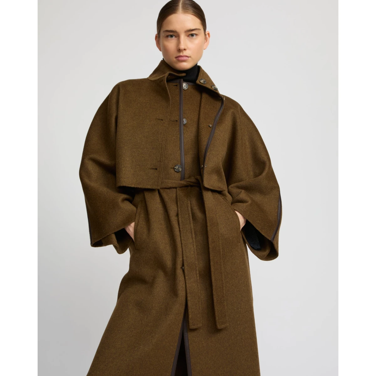 Woman wearing Yves Salomon shearling fur coat – luxury outerwear at Coveti
