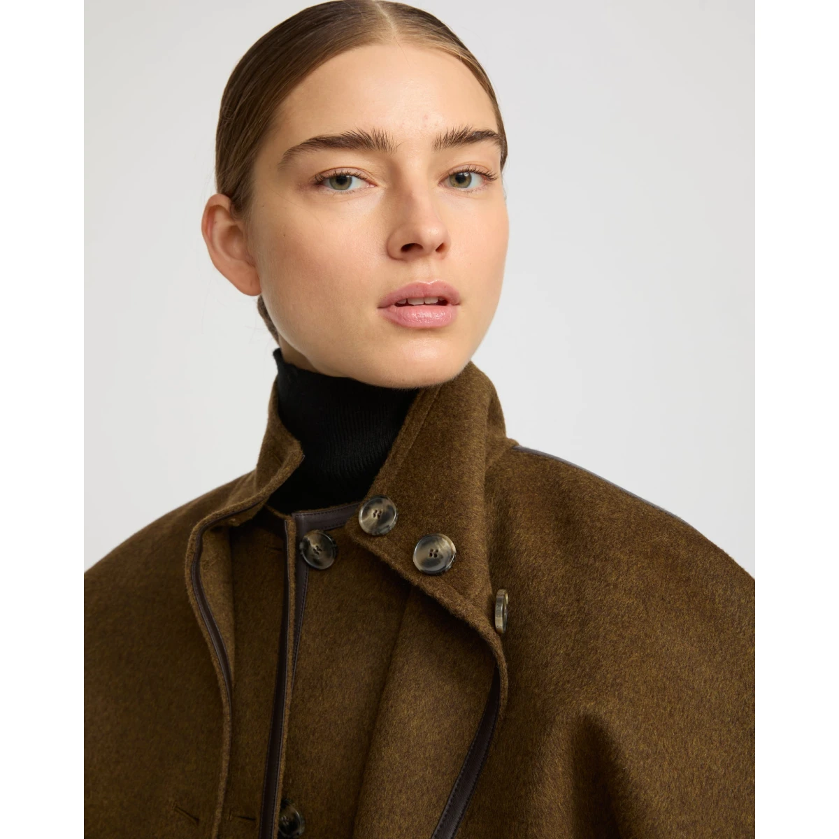 Woman wearing Yves Salomon shearling fur coat – luxury outerwear at Coveti