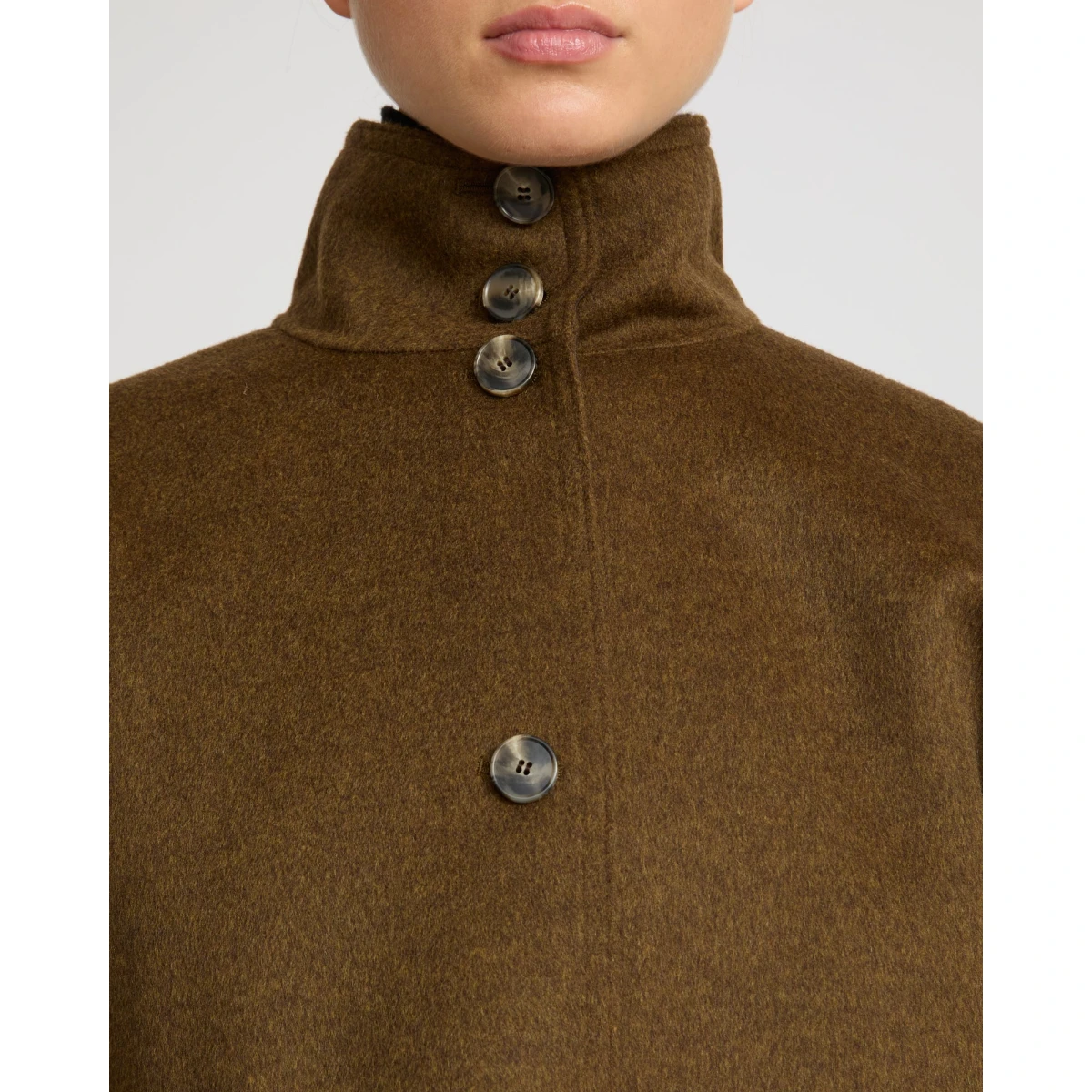 Woman wearing Yves Salomon shearling fur coat – luxury outerwear at Coveti