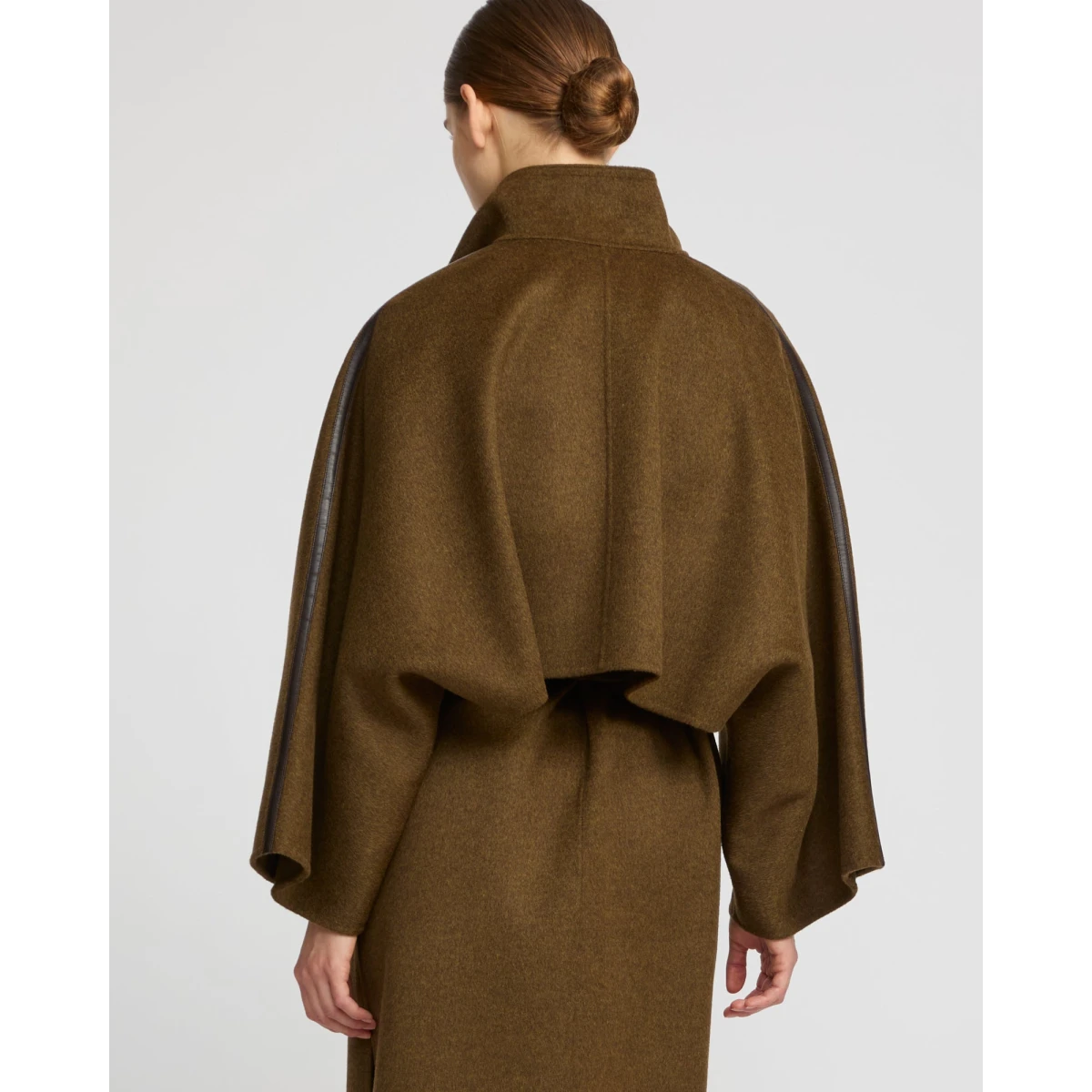 Woman wearing Yves Salomon shearling fur coat – luxury outerwear at Coveti