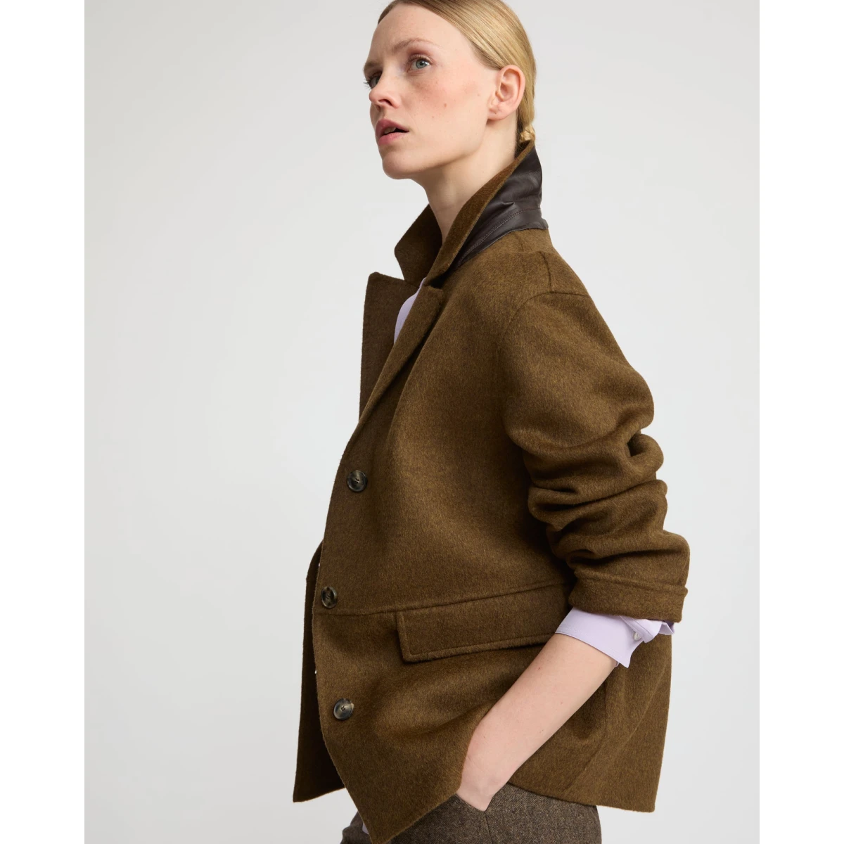 Woman wearing Yves Salomon shearling fur coat – luxury outerwear at Coveti