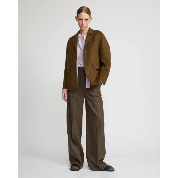 Woman wearing Yves Salomon shearling fur coat – luxury outerwear at Coveti