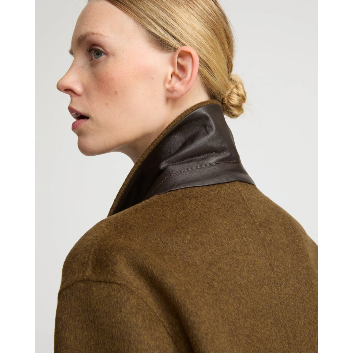 Woman wearing Yves Salomon shearling fur coat – luxury outerwear at Coveti