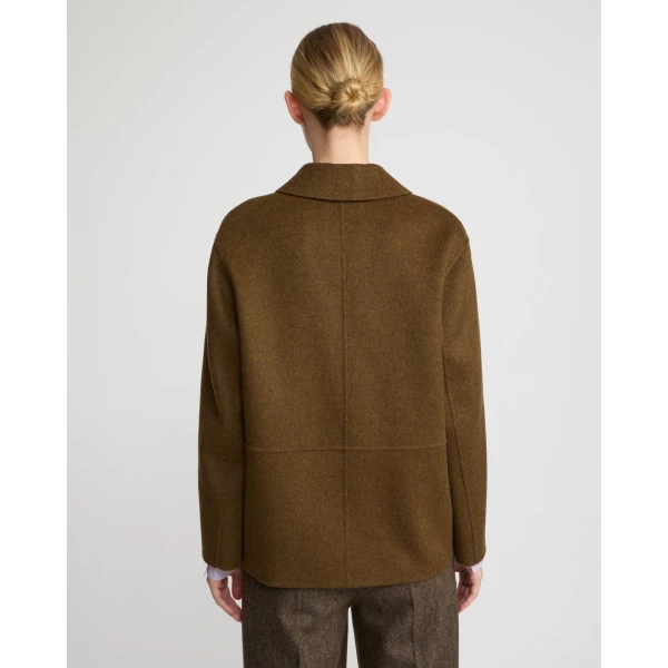 Woman wearing Yves Salomon shearling fur coat – luxury outerwear at Coveti
