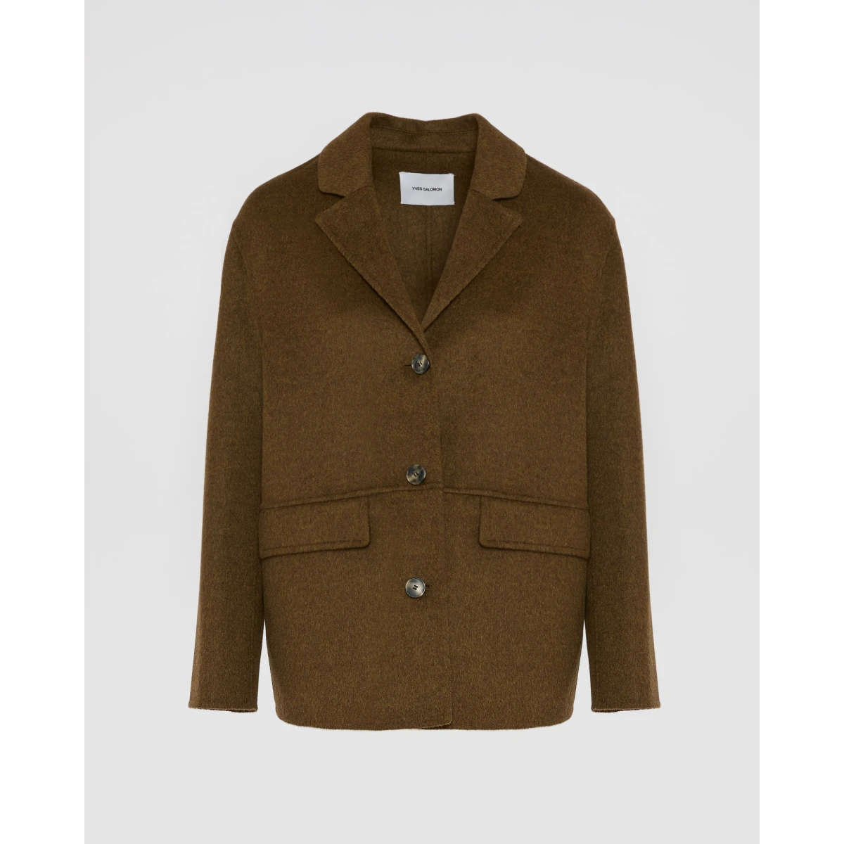 Woman wearing Yves Salomon shearling fur coat – luxury outerwear at Coveti