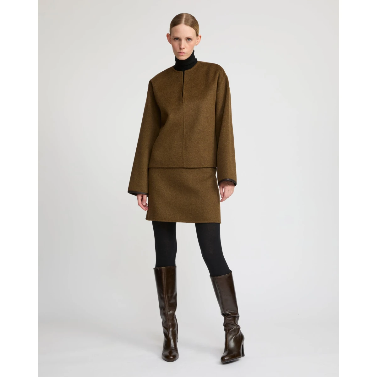 Woman wearing Yves Salomon shearling fur coat – luxury outerwear at Coveti