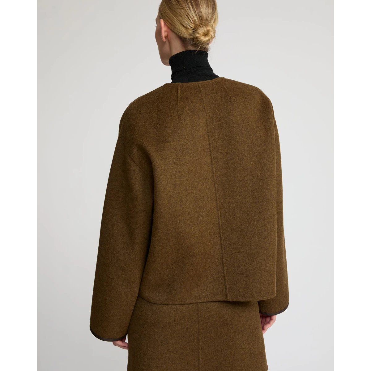 Woman wearing Yves Salomon shearling fur coat – luxury outerwear at Coveti