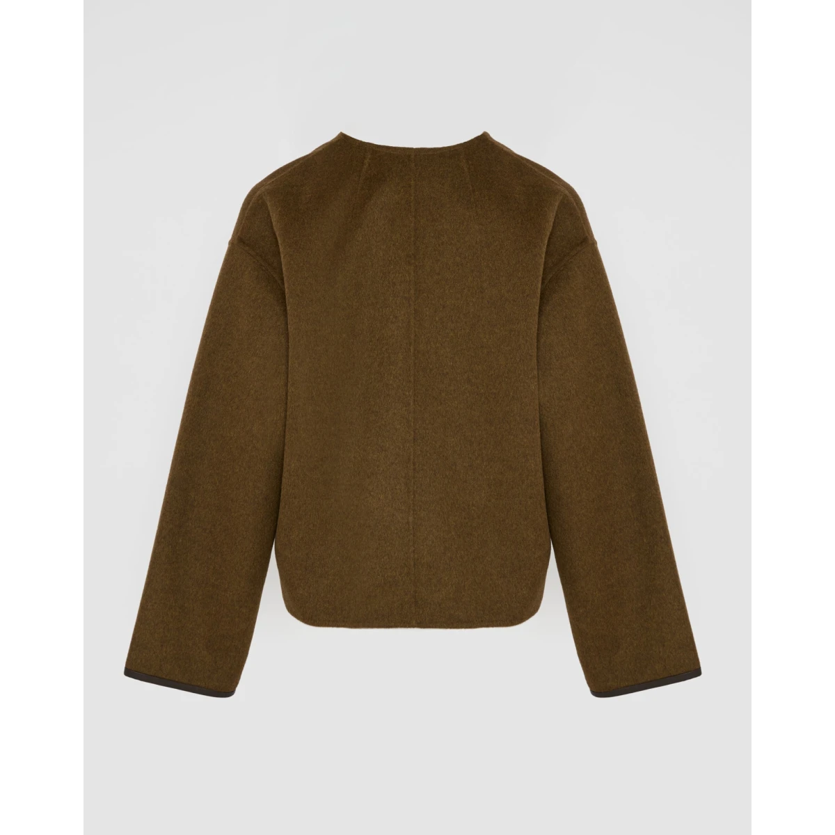 Woman wearing Yves Salomon shearling fur coat – luxury outerwear at Coveti