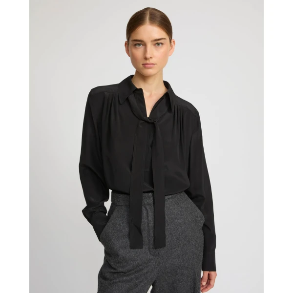 Woman wearing Yves Salomon shearling fur coat – luxury outerwear at Coveti
