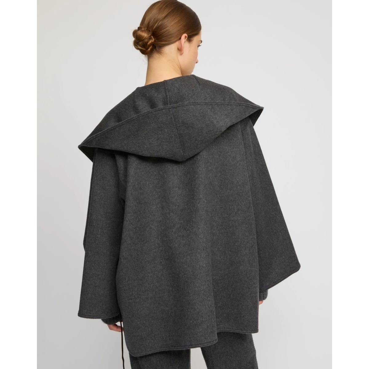 Woman wearing Yves Salomon shearling fur coat – luxury outerwear at Coveti