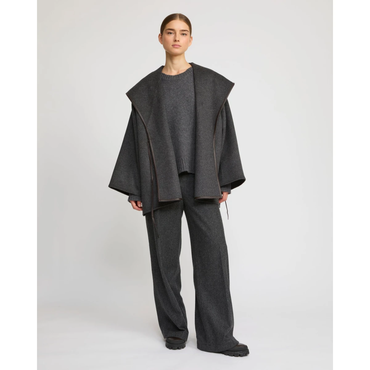 Woman wearing Yves Salomon shearling fur coat – luxury outerwear at Coveti