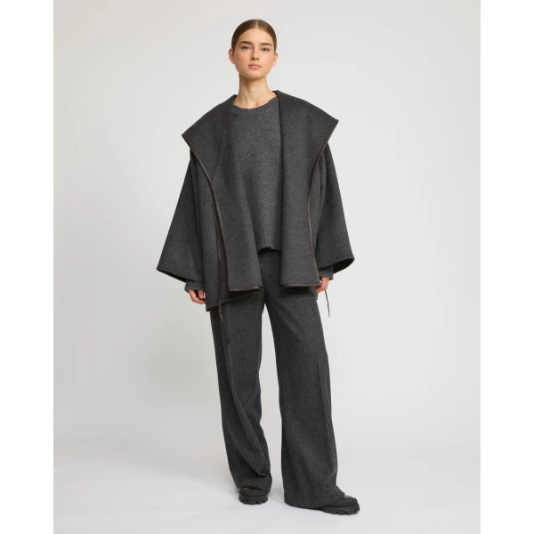 Woman wearing Yves Salomon shearling fur coat – luxury outerwear at Coveti